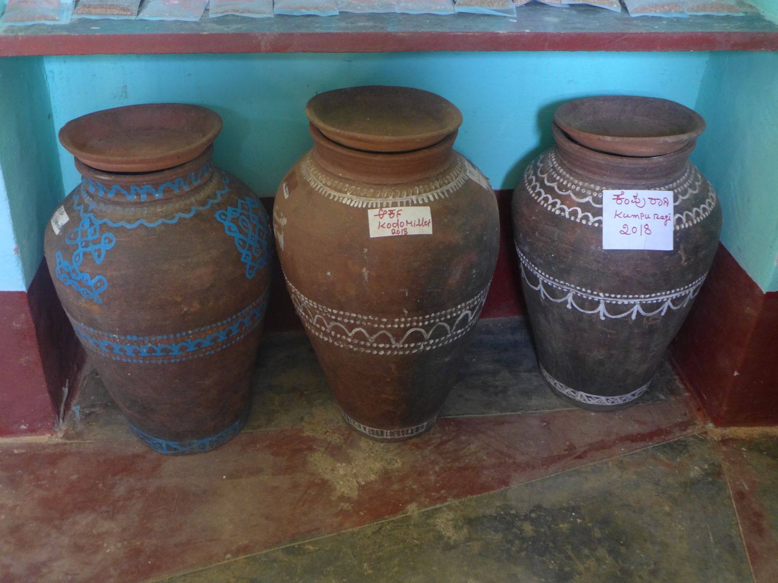 Traditional clay vessels for seed storage photo
