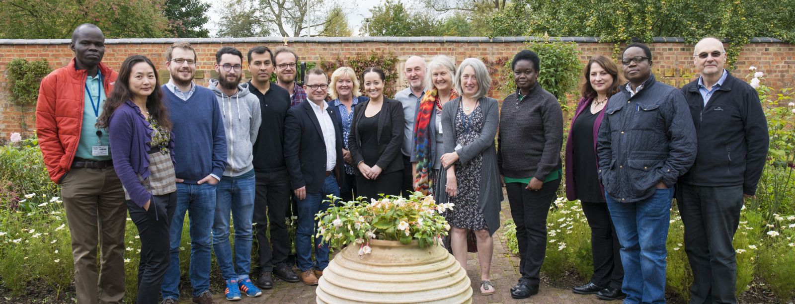 Team photo of the group in Development Policy and Practice in the OU's Legacy Garden