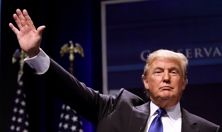Donald Trump with his hand in the air