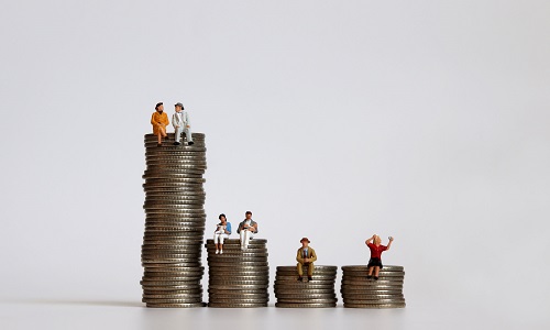 Concept of income inequality by stratum. Miniature people with a pile of coins. 