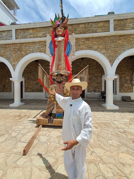 Jun Tiburcio standing in front of Totem Latamat