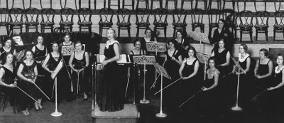 Women orchestra in black/white background