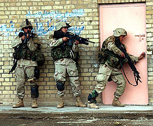 U.S. Army soldiers from TF 2–7 CAV, prepare to enter a building during fighting in Fallujah. - Second Battle of Fallujah