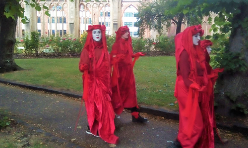 Extinction Rebellion Red Brigade activists protesting in Bristol, July 2019