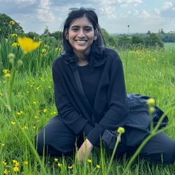 A monochrome photograph of Enbah Nilah in a grassy field