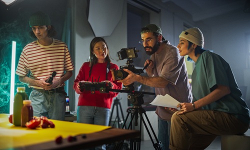 Young film crew engaged in a video production session