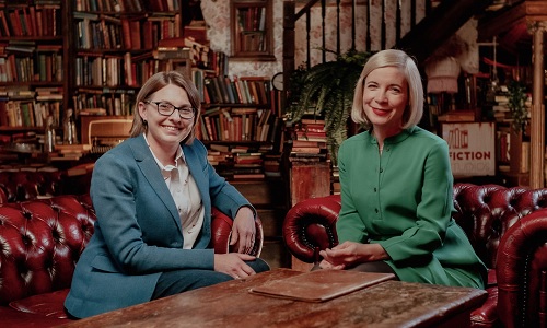 Professor Rosalind Crone and Lucy Worsley sit in leather armchairs around a wooden table in a Victorian library