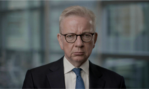 A dour looking Michael Gove, Conservative Member of Parliament and Cabinet Minister, facing the camera during an interview for the series.
