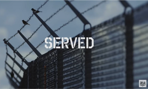 The title Served in military font is overlaid on an background of a prison fence topped with barbed wire on which two birds sit, and the logo of the Ministry of Justice in the bottom right hand corner.