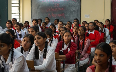 Girls learning in class