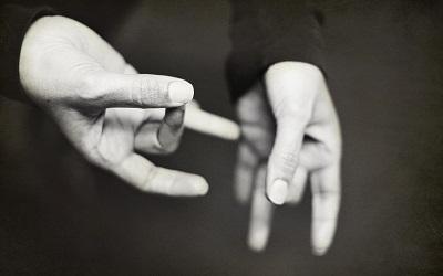 Black and white photograph of hands using sign language