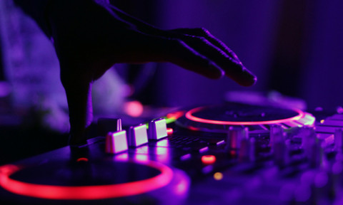 A DJ mixing music on turntables