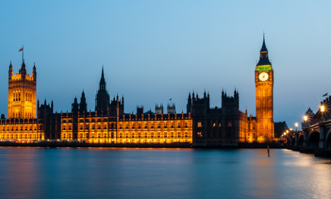 The Houses of Parliament lit up from across the Thames
