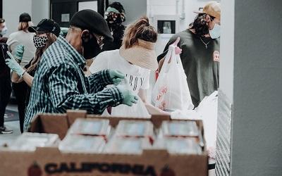 Photo shows a busy foodbank distribution centre, image by Joel Muniz on Unsplash