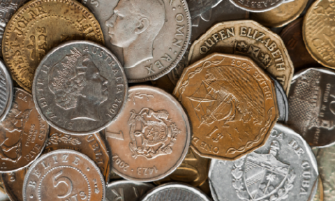 An assortment pile of international and local coins