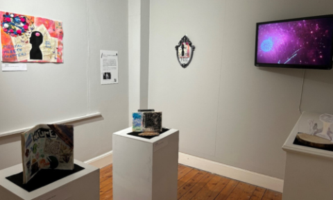 Student artwork is installed alongside a mirror installation from Face in the Hole and a video installation from Atsuhide Ito in the Art for a Better World exhibition