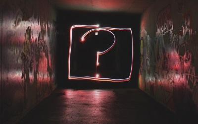 Photo by Emily Morter on Unsplash - picture shows a large question mark written in graffiti on a wall