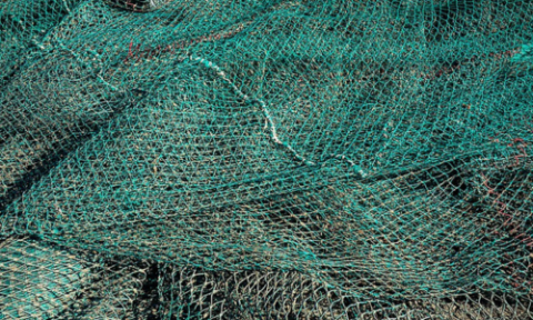 Fishing nets drying on the quay in Lysekil, South harbor, Sweden.