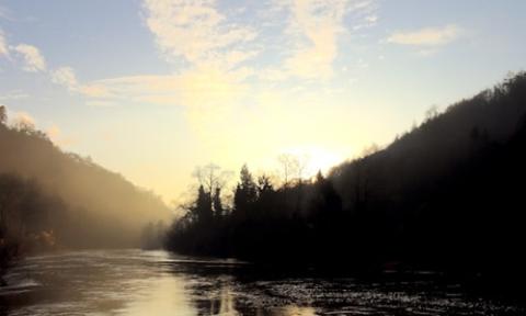 a body of water surrounded by a forest, Wye Valley, Buxton, UK