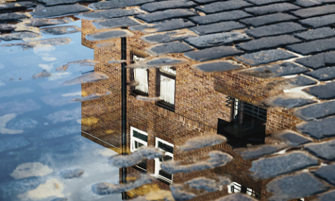 Puddle reflection of UK house