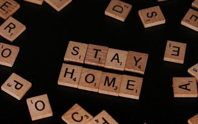 Scrabble letters spelling "STAY HOME"