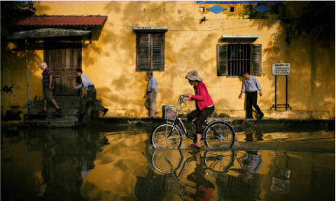 People wading through floodwaters 